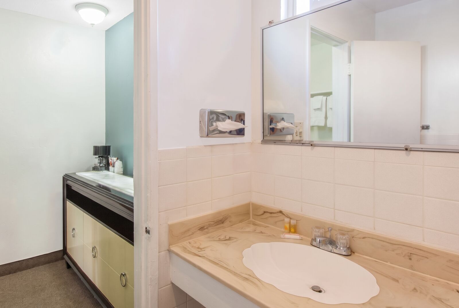 Bathroom vanity with a large mirror