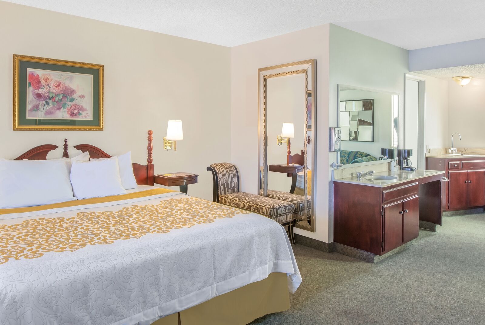 Suite bedroom with a vanity area