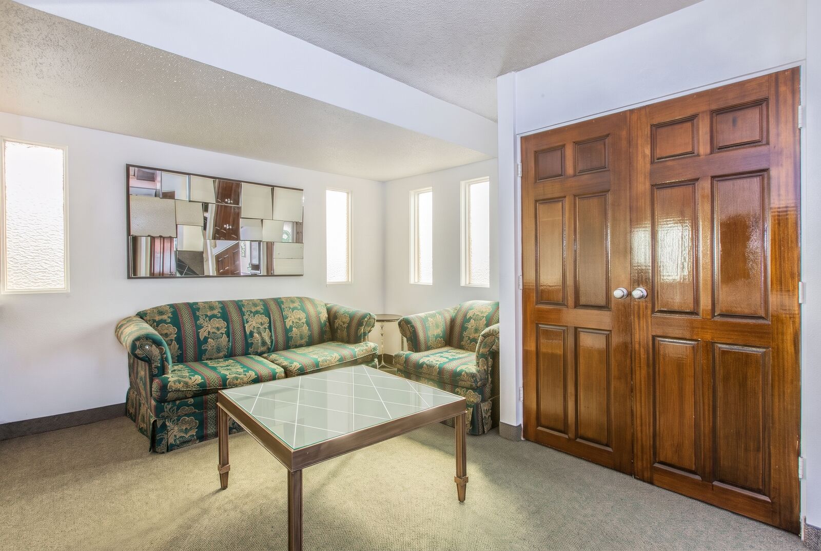 Suite sitting room with a sofa, armchair and coffee table
